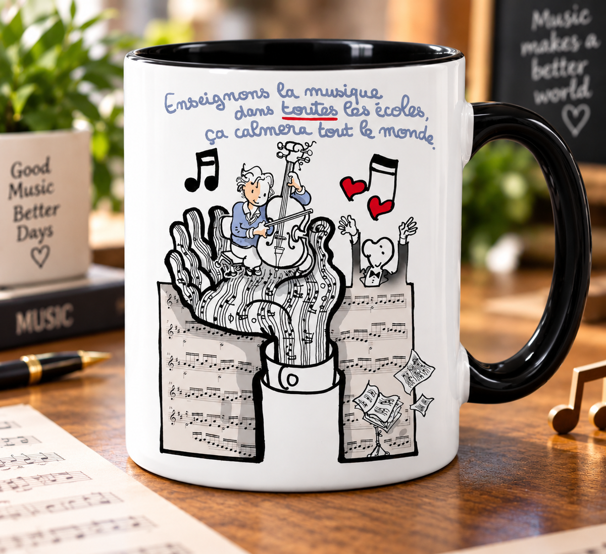 Mug blanc anse noire : dessin de Plantu, une main d'où jaillissent des portées, un violoncelliste assis dessus